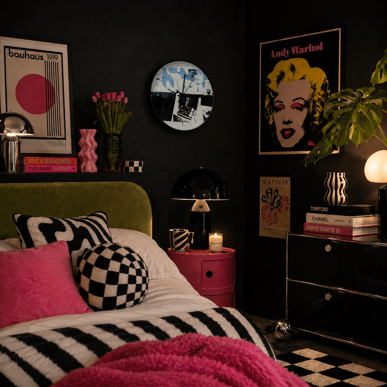 Modern bedroom with dark walls, colorful decor, and a bed with pink and black bedding.