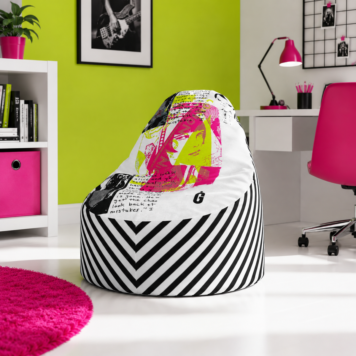 A bean bag chair with a black and white striped base and a colorful graphic print on top, placed in a modern room with a lime green wall, white desk, and pink chair.
