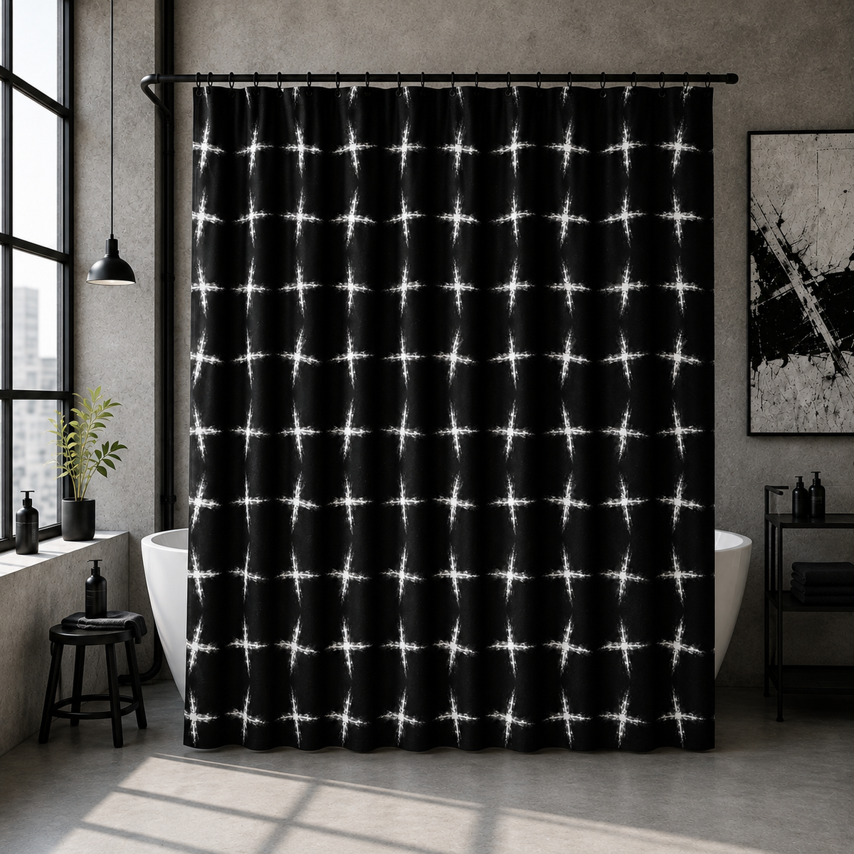 A black shower curtain with a white tie-dye cross pattern hanging in a modern, industrial-style bathroom next to a white bathtub.