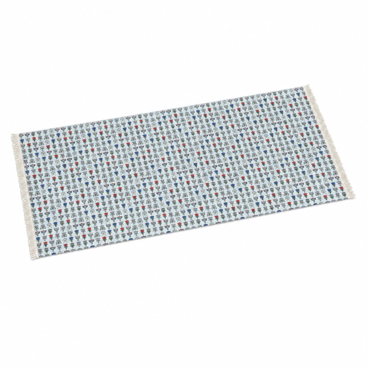 A rectangular woven runner rug with a light blue-gray base and a repeating pattern of small red, blue, and white motifs, finished with white fringe on the short ends.