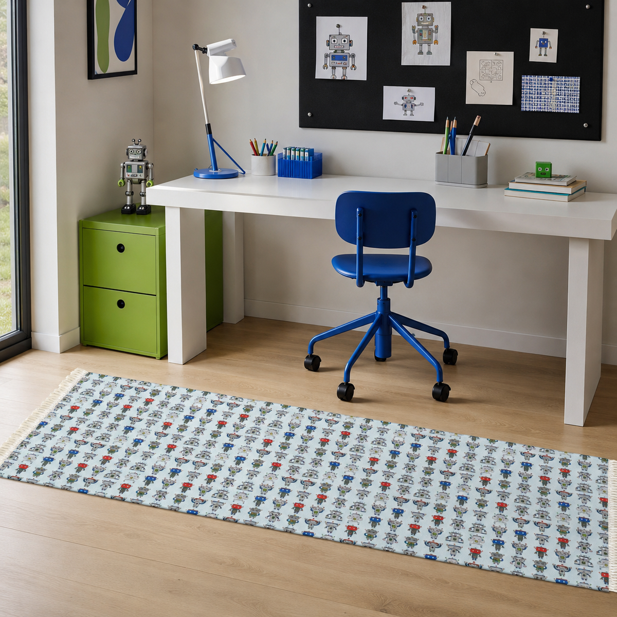 A long runner rug with a repeating pattern of cartoon robots on a white background, styled on a light wood floor in a child's study room next to a white desk and blue chair.