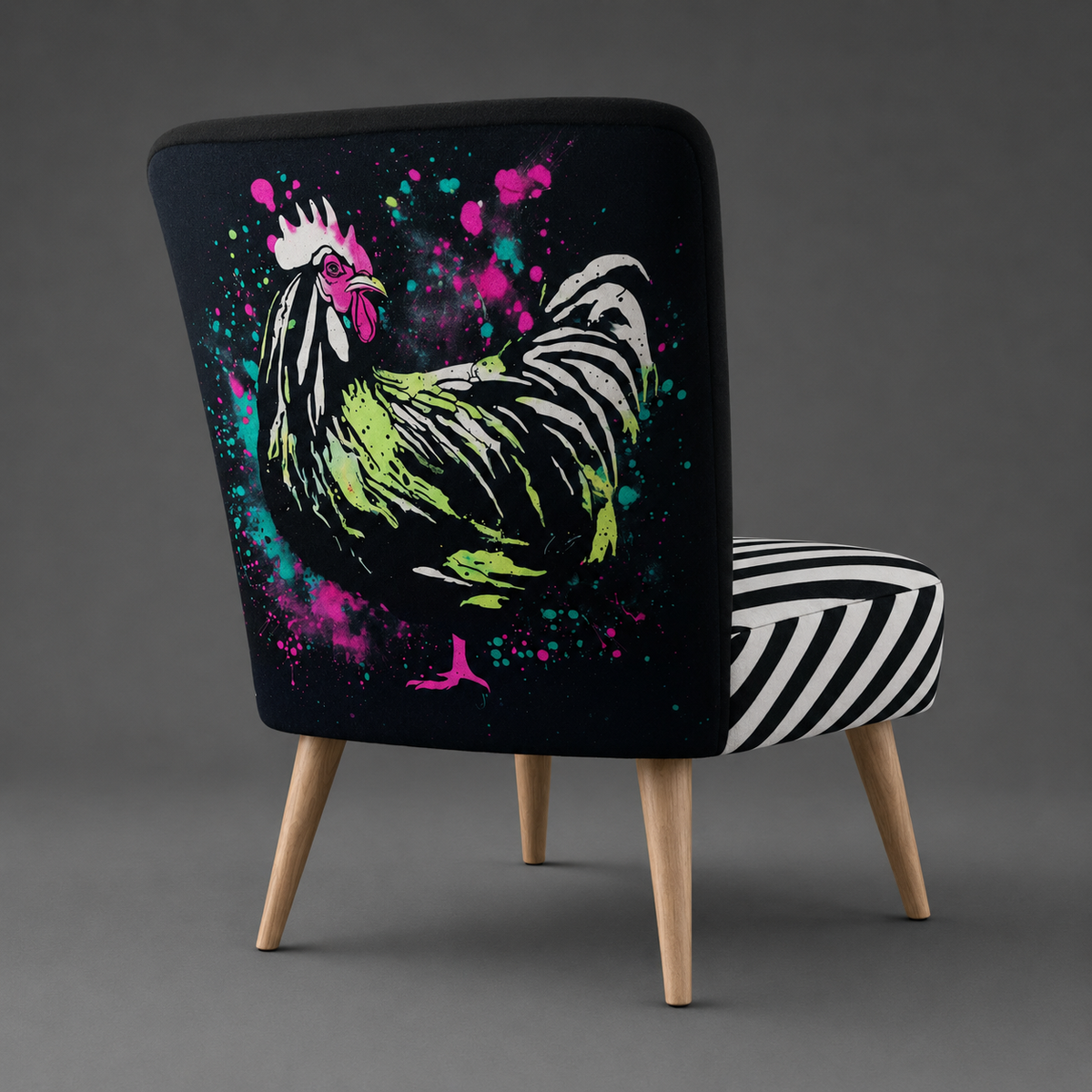 A modern upholstered accent chair with a black backrest featuring a colorful rooster graphic in neon green, pink, and white, paired with a black-and-white striped seat cushion and light wood legs, shown on a gray studio background.
