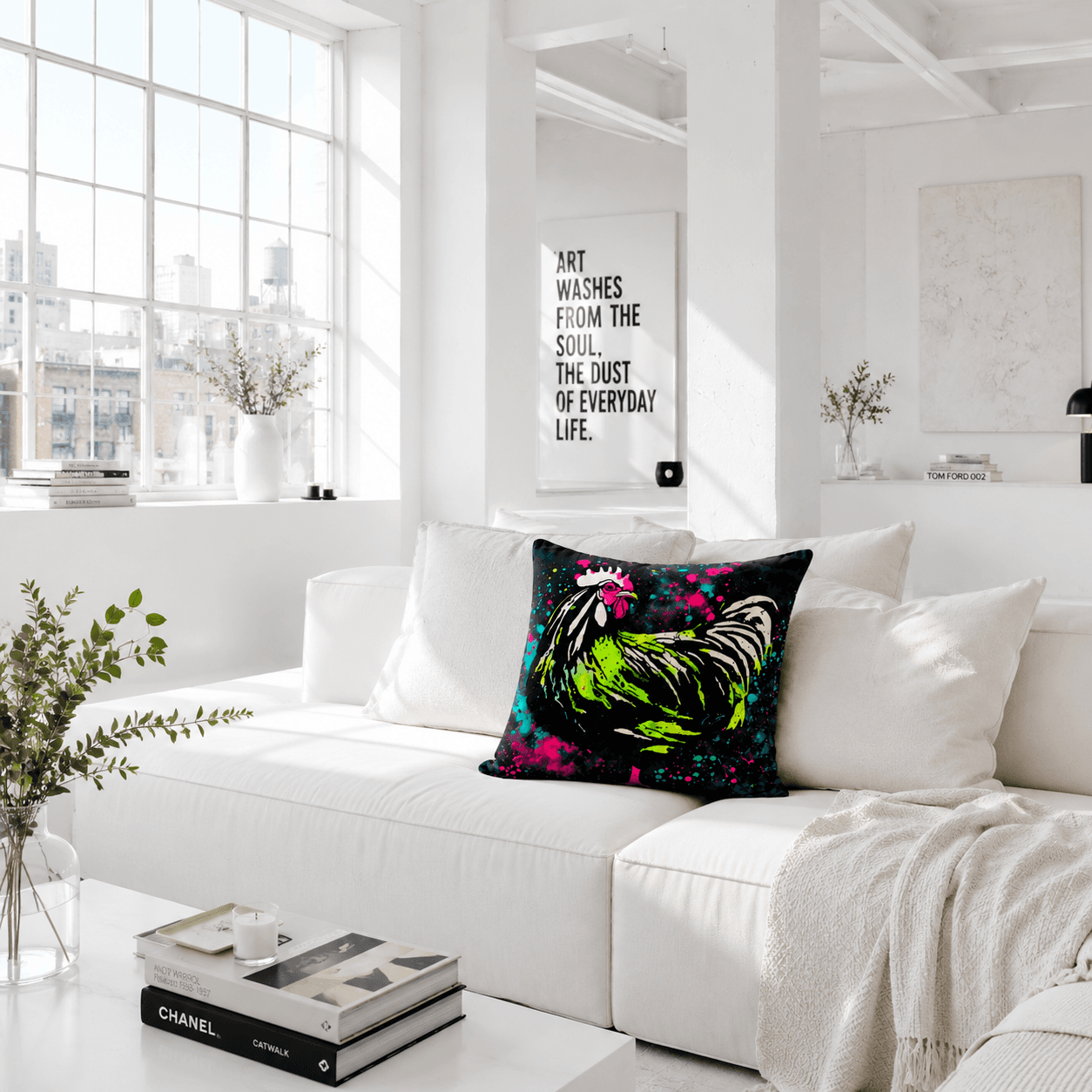 Modern living room with a white sofa, colorful pillow, and decor elements.